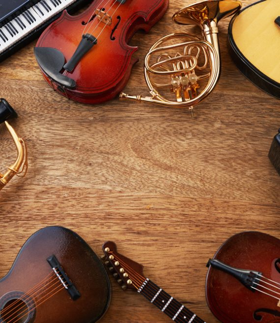 frame-different-musical-instruments-wooden-background